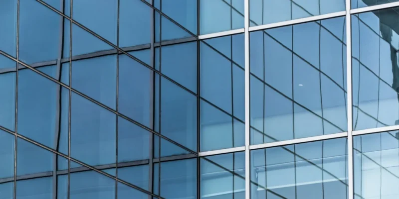 Modern-building-facade-with-reflective-blue-architectural-glass-1024x684